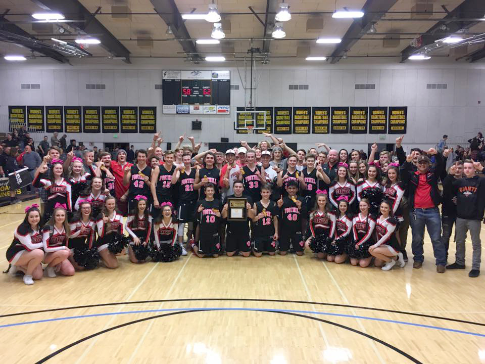basketball and cheer teams posed in rows in gym